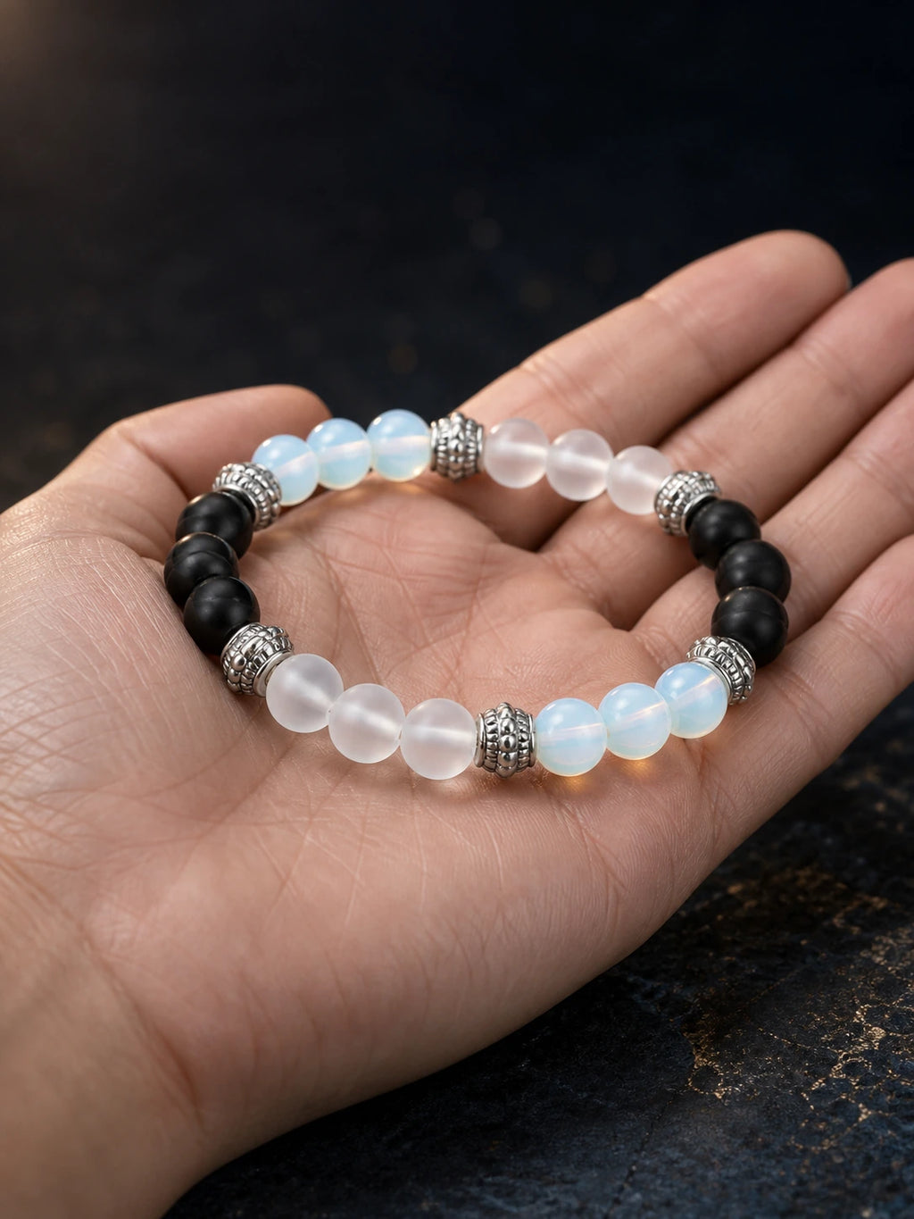 Agate Yoga Grounding Bracelet shown in hand for scale