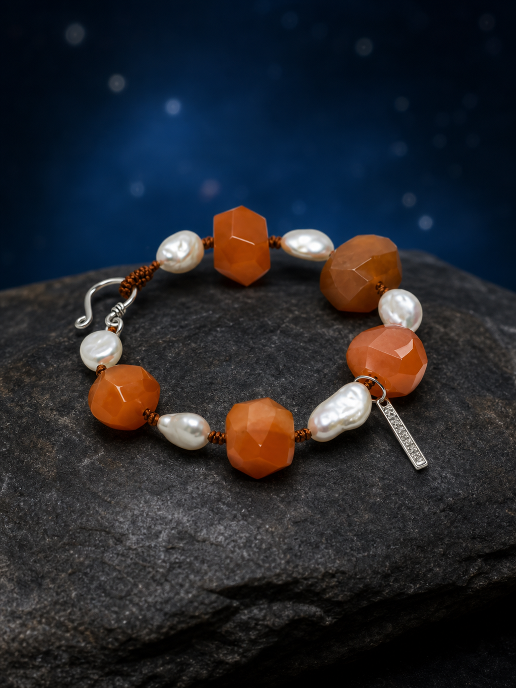 Amber Drift Agate Pearl Bracelet front view on a dark atmospheric backdrop