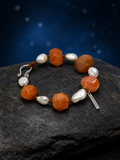 Amber Drift Agate Pearl Bracelet front view on a dark atmospheric backdrop