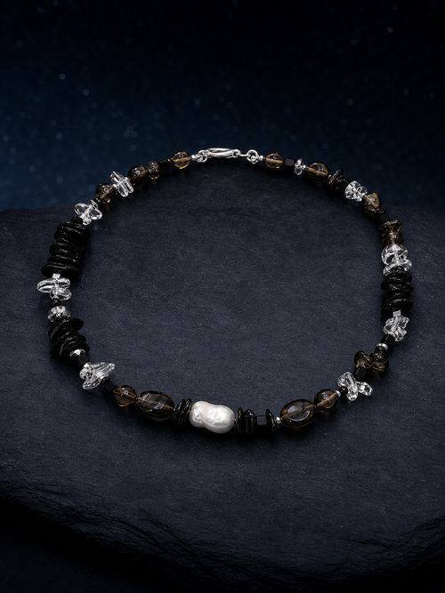 Ash Sequence Smoky Quartz Necklace front view on a dark atmospheric backdrop