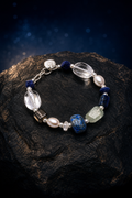 Azure Core Lapis Quartz Bracelet front view on a dark atmospheric backdrop