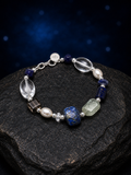 Azure Prism Lapis Quartz Bracelet front view on a dark atmospheric backdrop