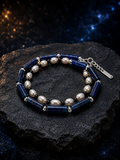 Blue Sentinel Pearl Bracelet front view on a dark atmospheric backdrop