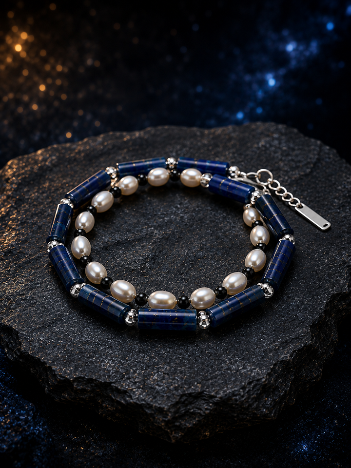 Blue Sentinel Pearl Bracelet front view on a dark atmospheric backdrop