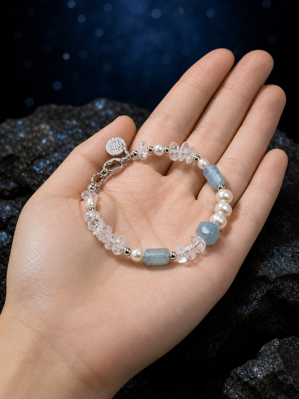 Crystal Tide Blue Onyx Bracelet shown in hand for scale