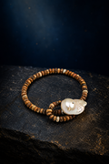 Forest Amber Pearl Bracelet front view on a dark atmospheric backdrop