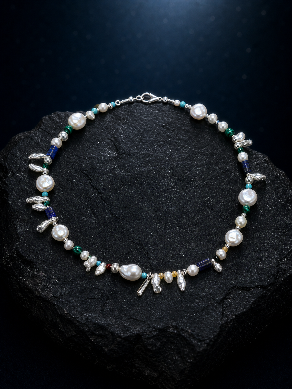 Forest Isle Silver Sequence Necklace front view on a dark atmospheric backdrop