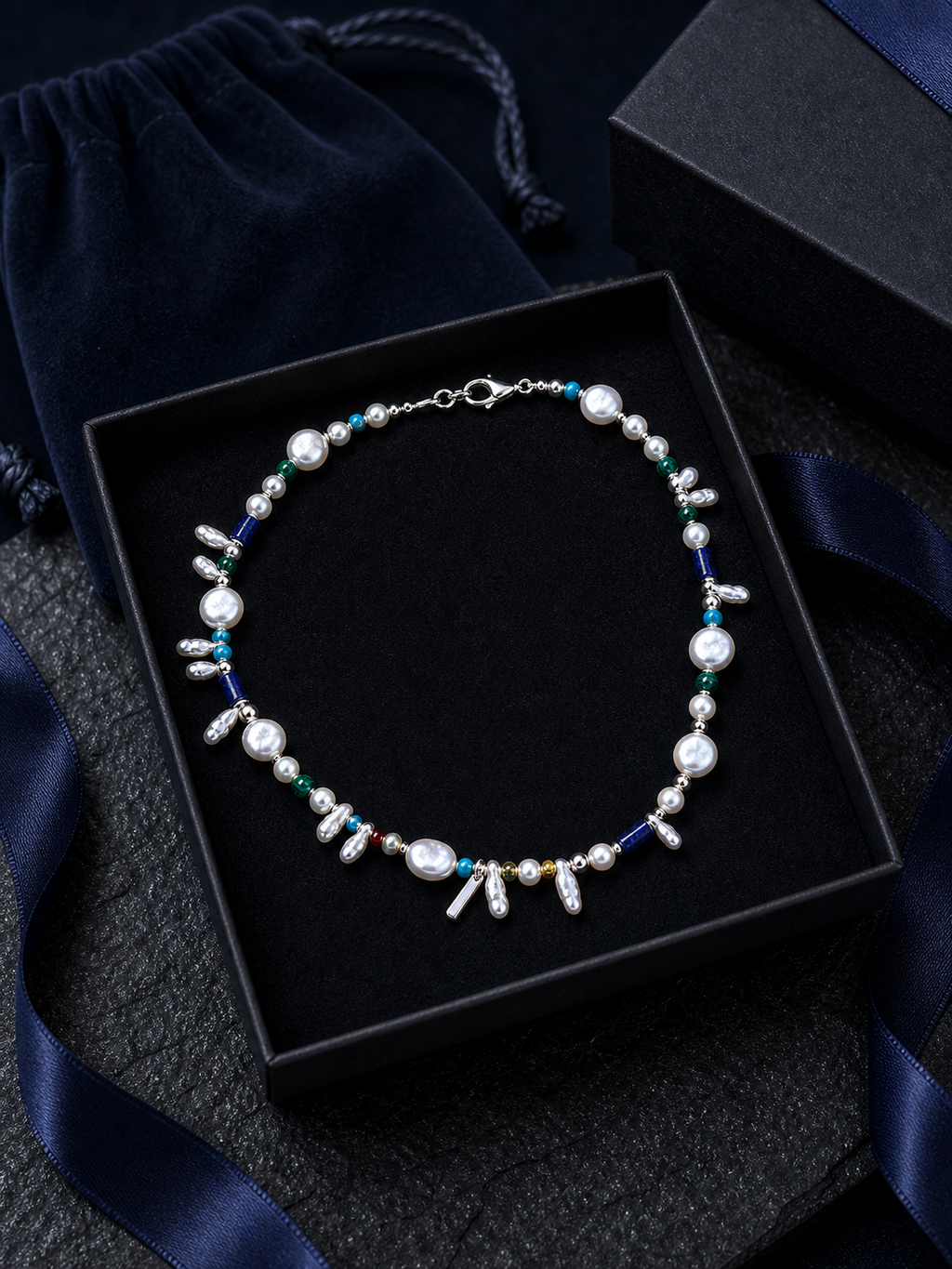 Forest Isle Silver Sequence Necklace packaging flat lay