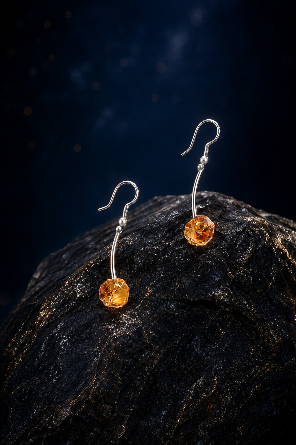 Golden Arc Citrine Earrings (5.5 cm) front view on a dark atmospheric backdrop