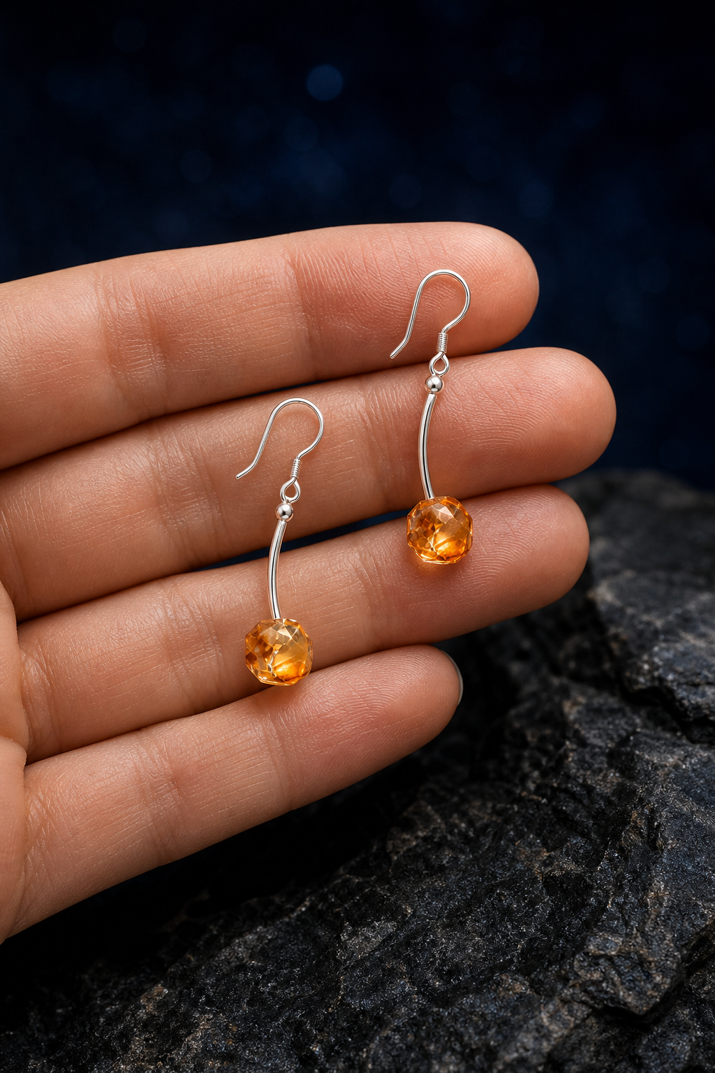 Golden Arc Citrine Earrings (5.5 cm) shown in hand for scale