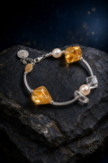 Golden Link Citrine Pearl Bracelet front view on a dark atmospheric backdrop
