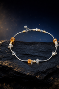Golden Rivulet Citrine Pearl Necklace front view on a dark atmospheric backdrop