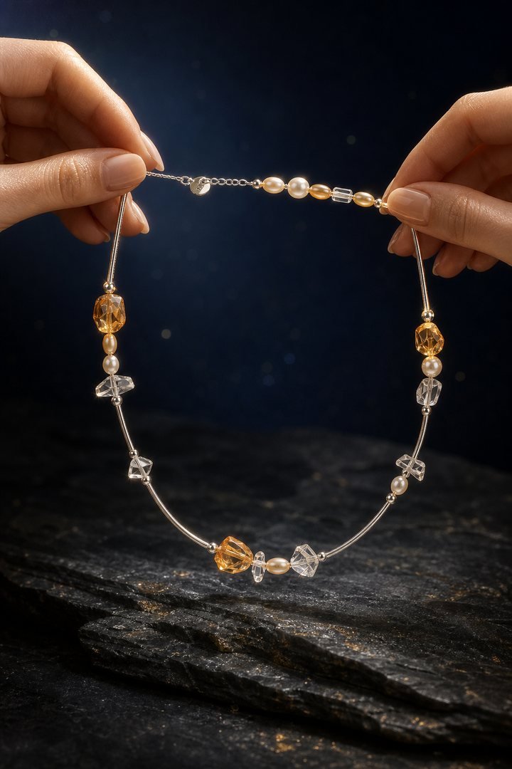 Golden Rivulet Citrine Pearl Necklace shown in hand for scale