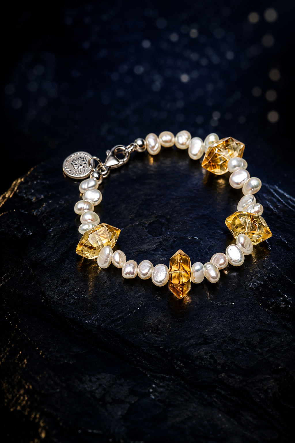 Golden Tide Citrine Pearl Bracelet front view on a dark atmospheric backdrop