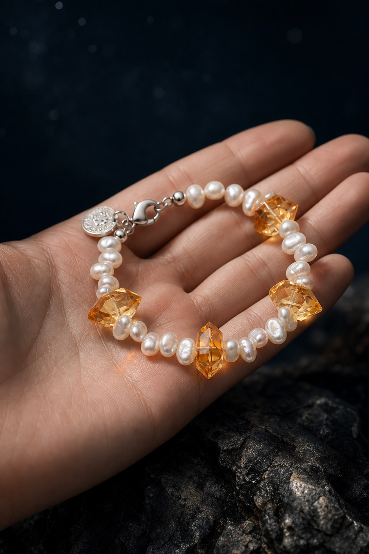 Golden Tide Citrine Pearl Bracelet shown in hand for scale