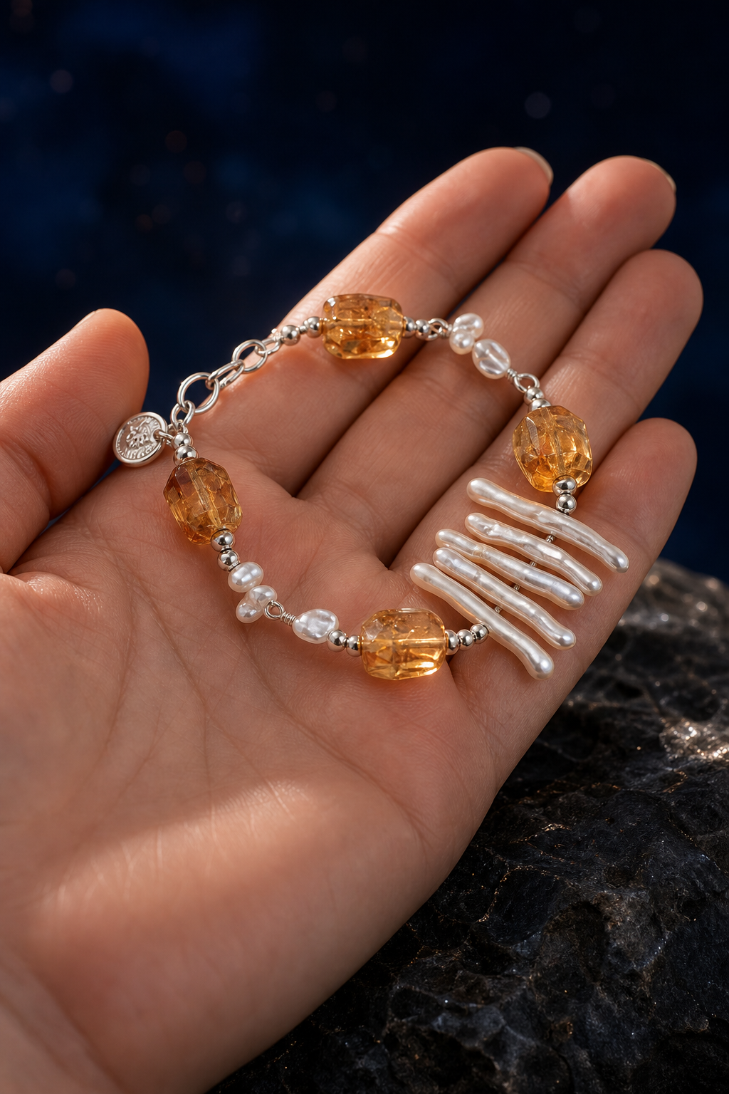 Honey Fringe Citrine Pearl Bracelet shown in hand for scale