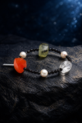Jadeflare Mixed Gem Bracelet front view on a dark atmospheric backdrop