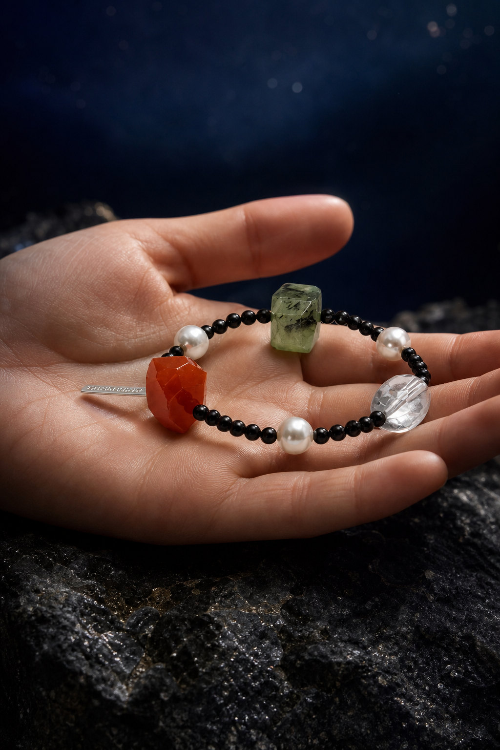 Jadeflare Mixed Gem Bracelet shown in hand for scale