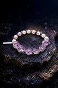 Lilac Drift Amethyst Bracelet front view on a dark atmospheric backdrop