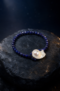 Midnight Lapis Pearl Bracelet front view on a dark atmospheric backdrop