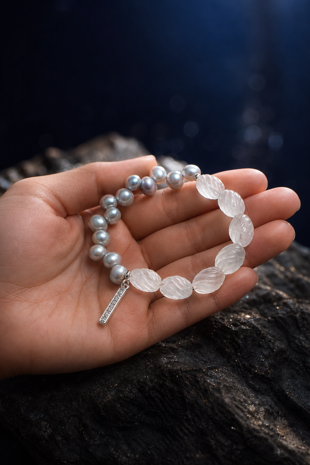 Mistglass Quartz Pearl Bracelet shown in hand for scale