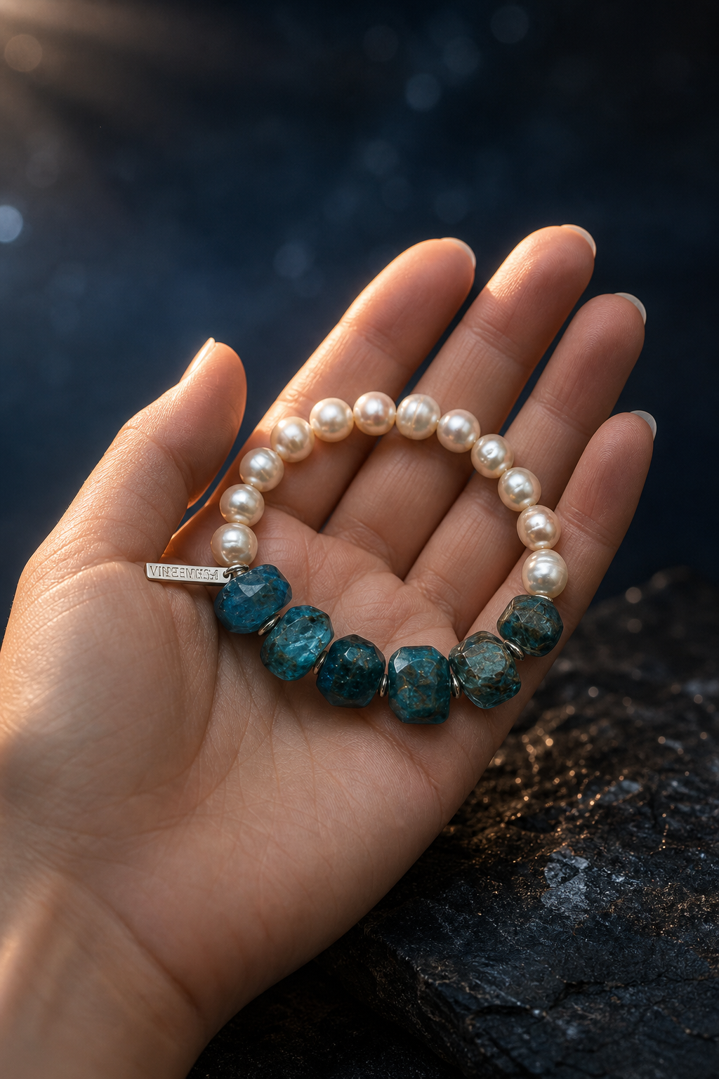 Mooncurrent Blue Apatite Pearl Bracelet shown in hand for scale