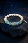Moonglow Blue Pearl Bracelet front view on a dark atmospheric backdrop