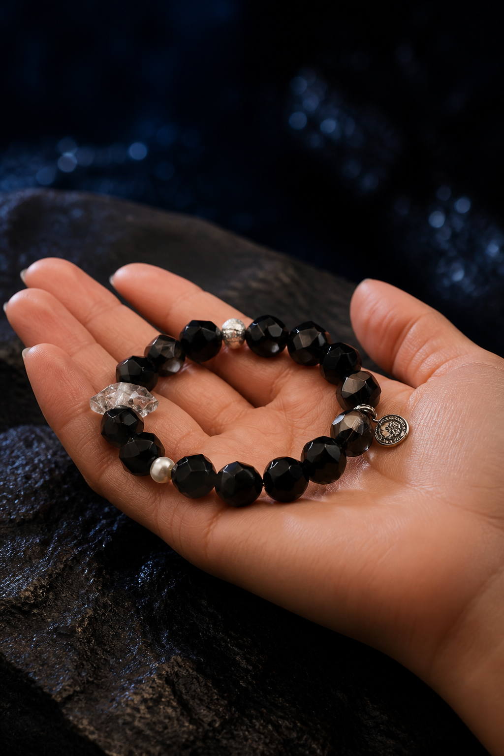 Night Current Agate Quartz Bracelet shown in hand for scale