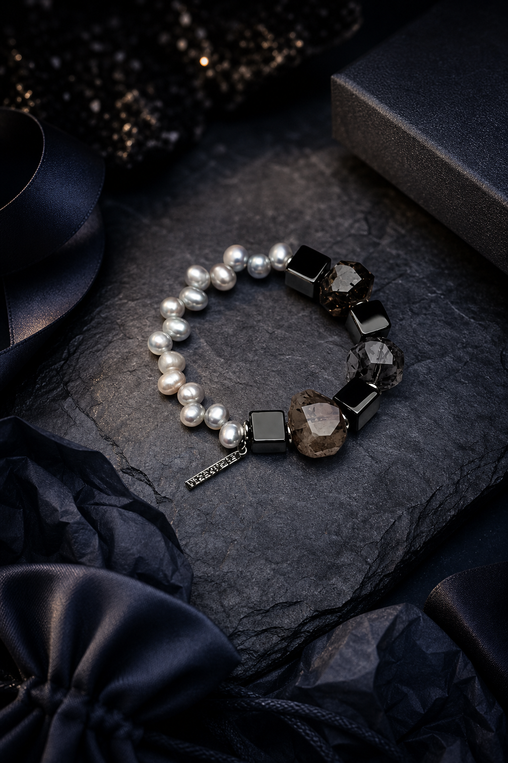 Obsidian Current Bracelet packaging flat lay