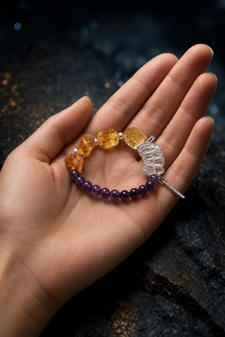Purple Ember Bracelet shown in hand for scale