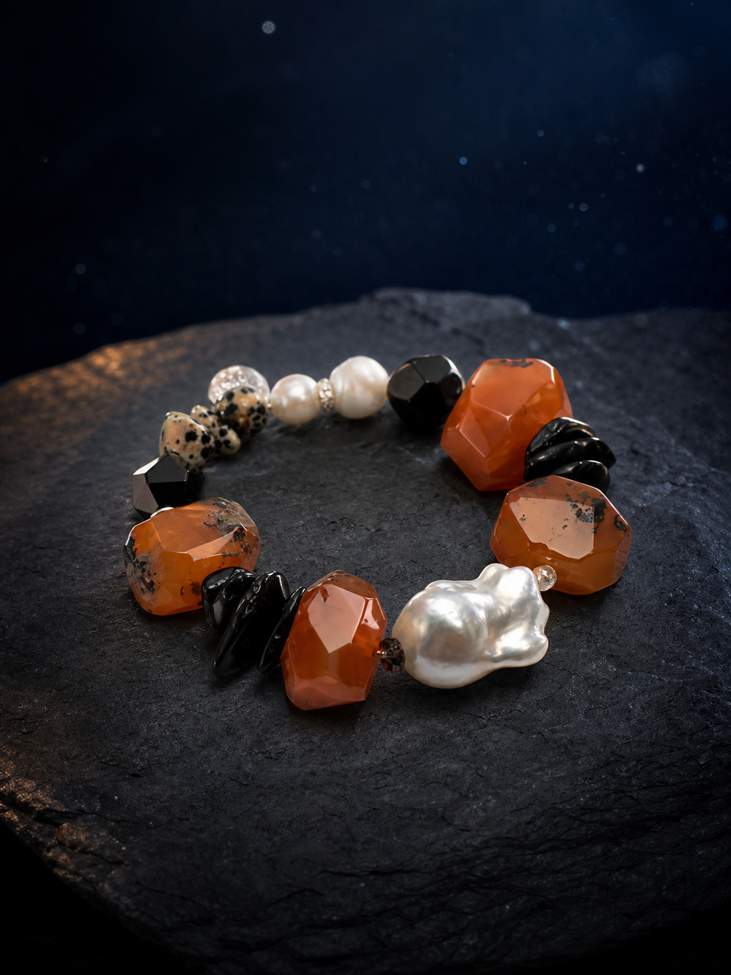 Red Tide Baroque Pearl Bracelet front view on a dark atmospheric backdrop