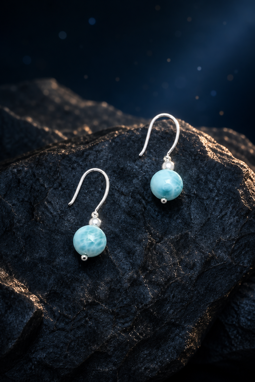 Ripple Light Larimar Earrings (3.3 cm) front view on a dark atmospheric backdrop