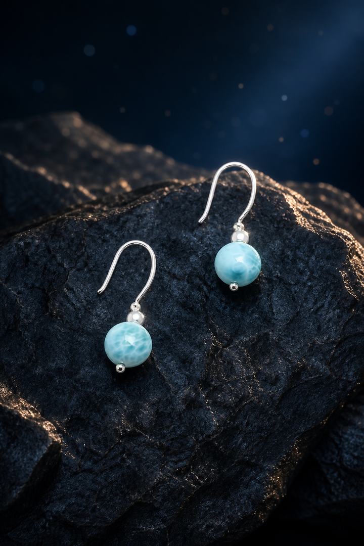 Ripple Light Larimar Earrings (3.3 cm) front view on a dark atmospheric backdrop