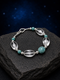 River Glass Amazonite Quartz Bracelet front view on a dark atmospheric backdrop