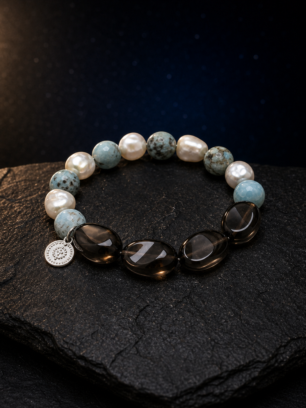 Sea Veil Smoky Pearl Bracelet front view on a dark atmospheric backdrop