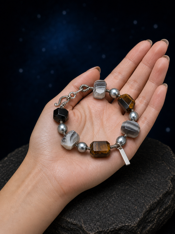 Shadow Current Tiger's Eye Bracelet shown in hand for scale