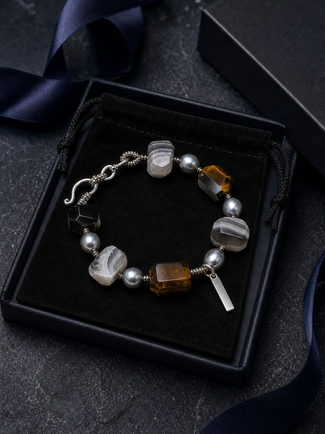 Shadow Current Tiger's Eye Bracelet packaging flat lay