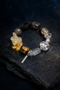 Shadow Ember Tiger's Eye Bracelet front view on a dark atmospheric backdrop