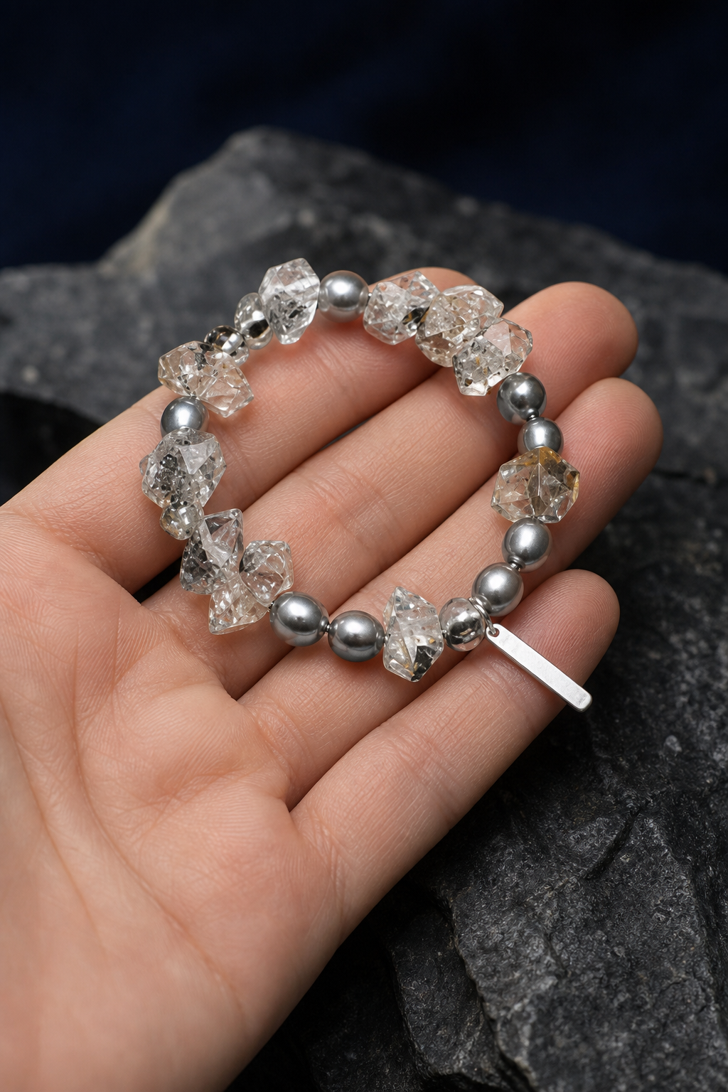 Slate Current Smoky Quartz Bracelet shown in hand for scale