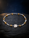 Solar Thread Citrine Pearl Necklace front view on a dark atmospheric backdrop