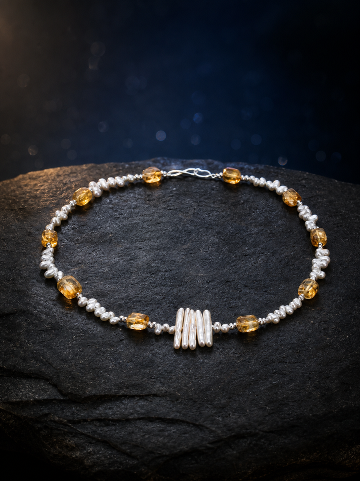 Solar Thread Citrine Pearl Necklace front view on a dark atmospheric backdrop