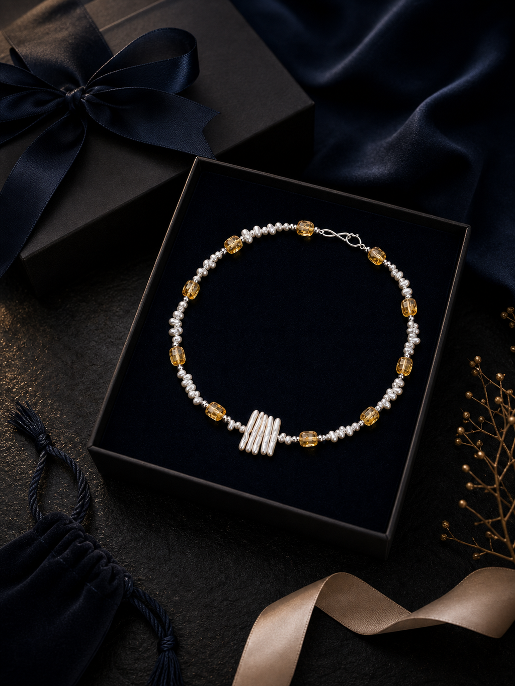 Solar Thread Citrine Pearl Necklace packaging flat lay