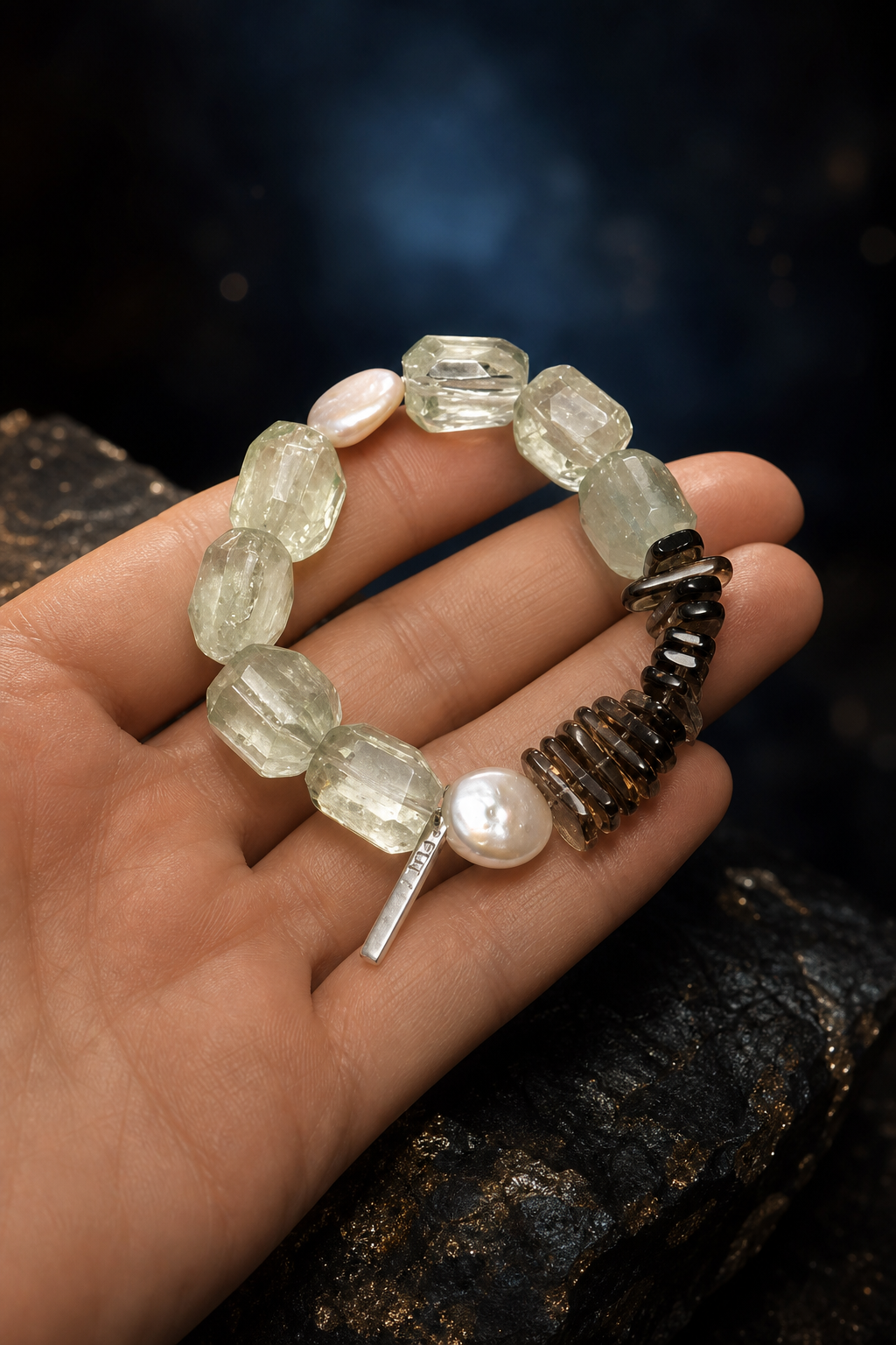Verdant Ember Crystal Pearl Bracelet shown in hand for scale