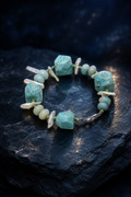 Verdant Rain Malachite Pearl Bracelet front view on a dark atmospheric backdrop
