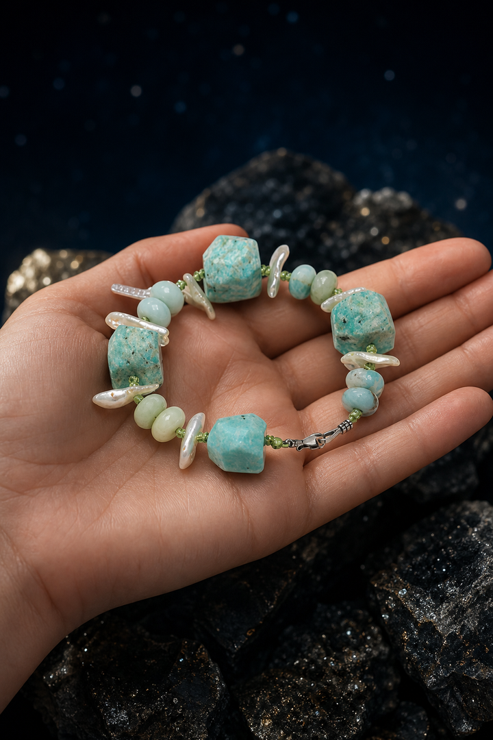 Verdant Rain Malachite Pearl Bracelet shown in hand for scale
