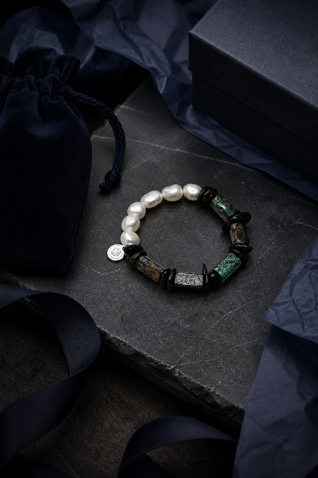 Verdigris Ore Pearl Bracelet packaging flat lay