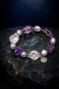 Violet Mist Amethyst Pearl Bracelet front view on a dark atmospheric backdrop